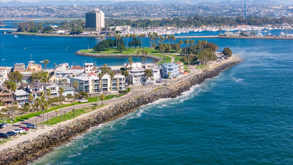 an aerial view of a city by the water