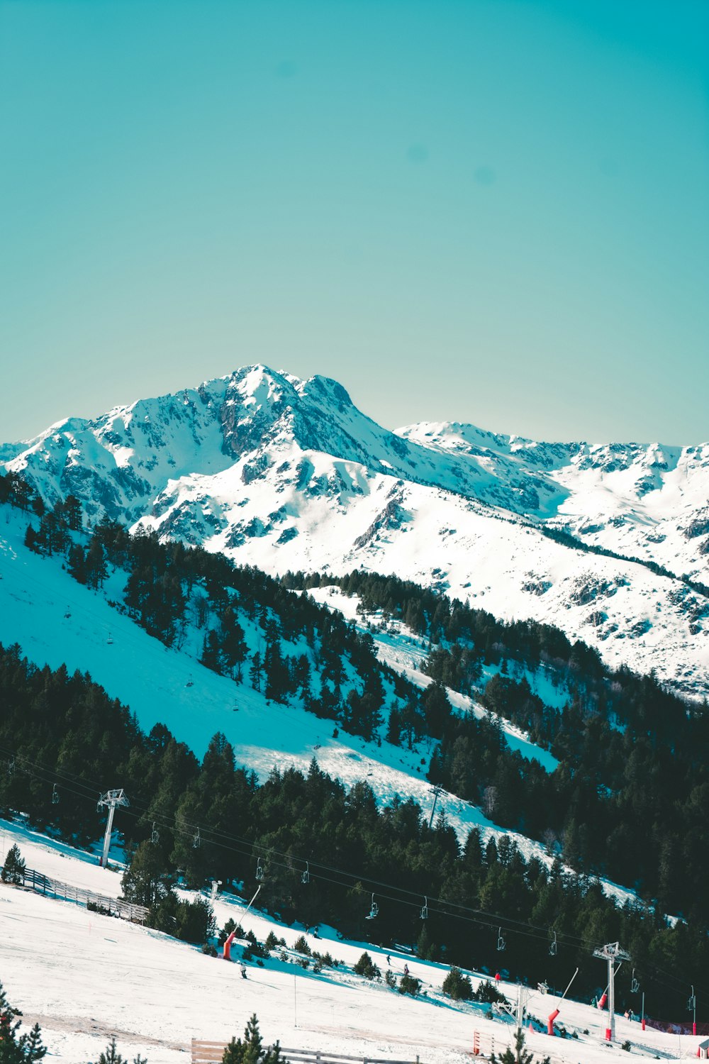 a mountain covered in snow with a sky background