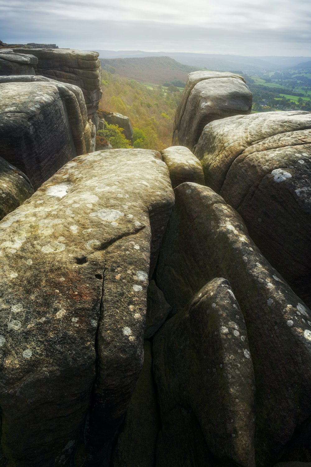 a large rock formation in the middle of a field