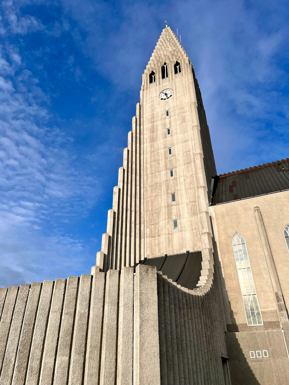 a very tall building with a clock on it's side