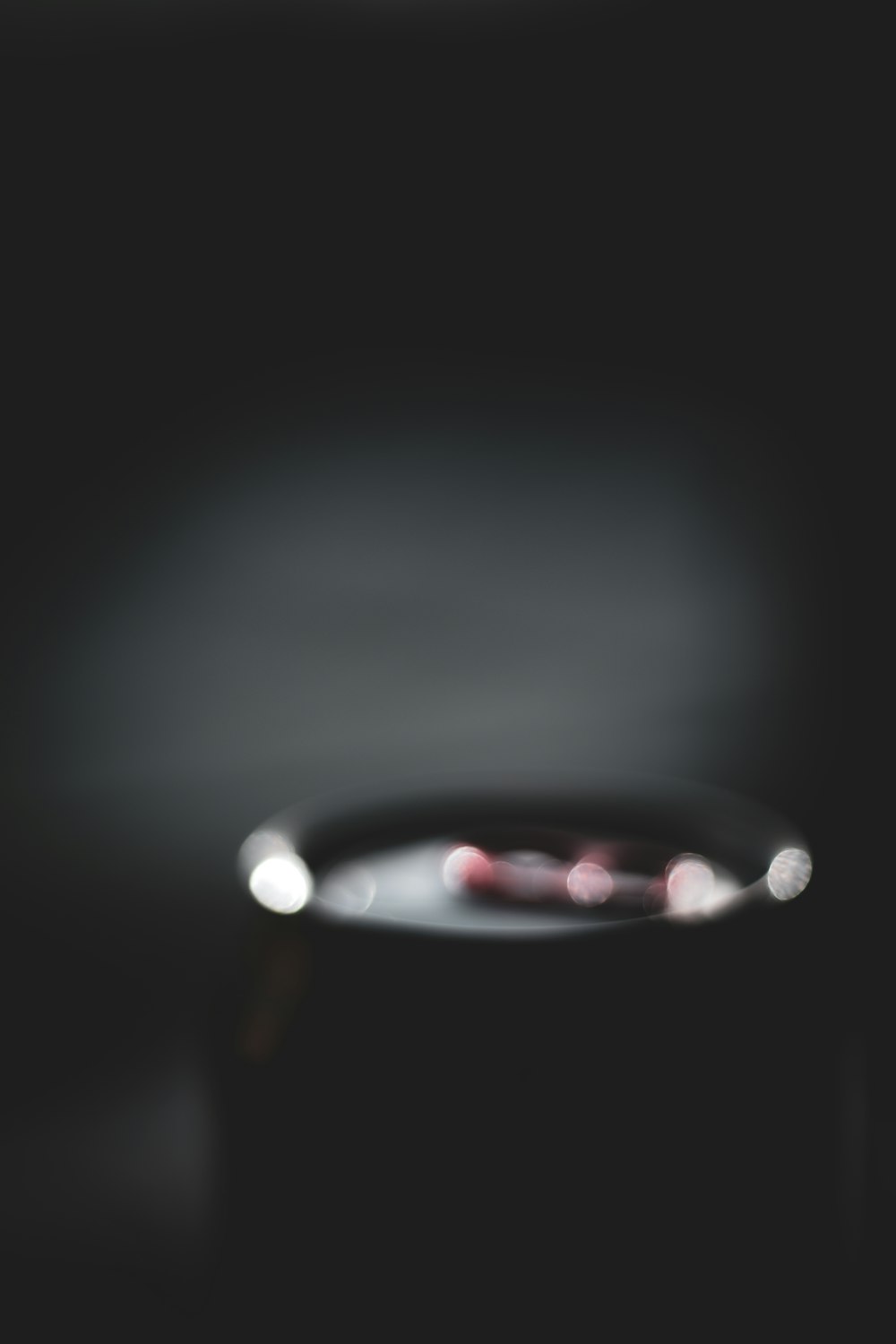 a close up of a black object with a blurry background