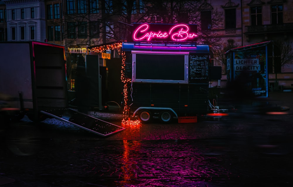 a food truck parked on the side of a street