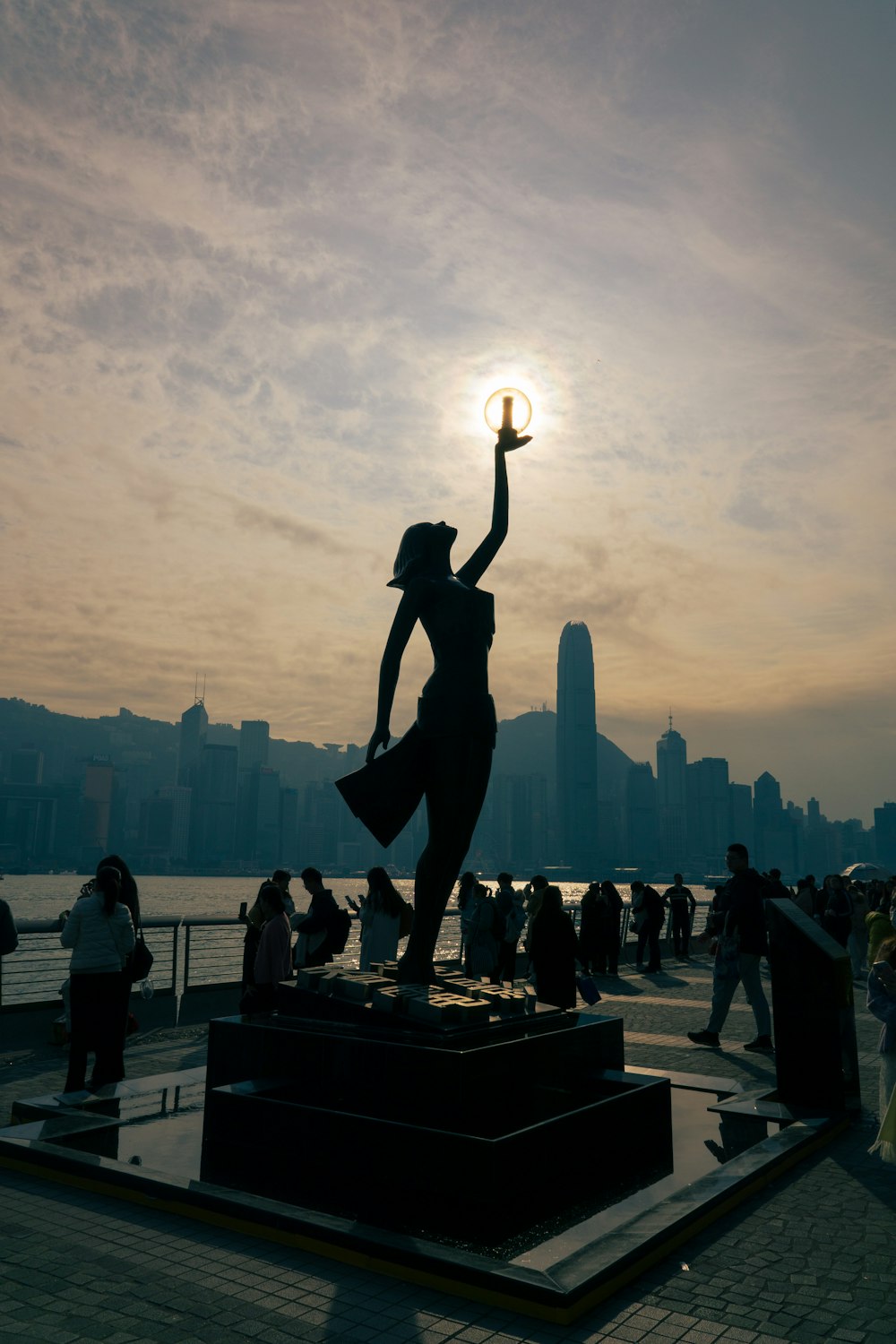 a statue of a woman holding a ball in her hand