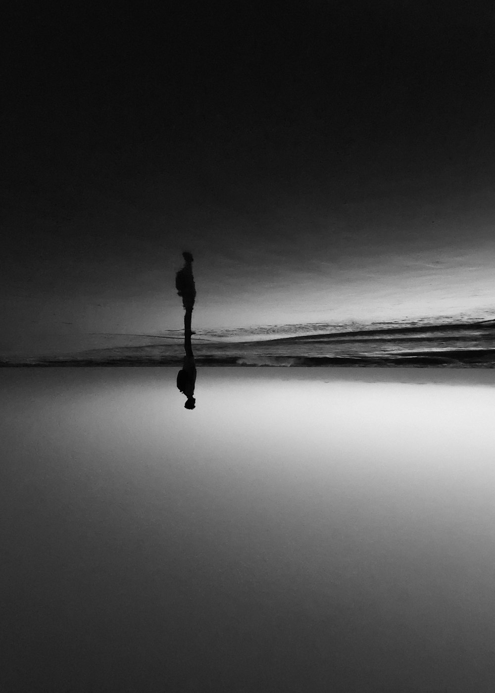 a person standing in the middle of a body of water