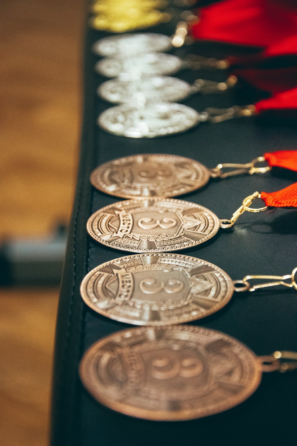 a row of coin key chains on a table