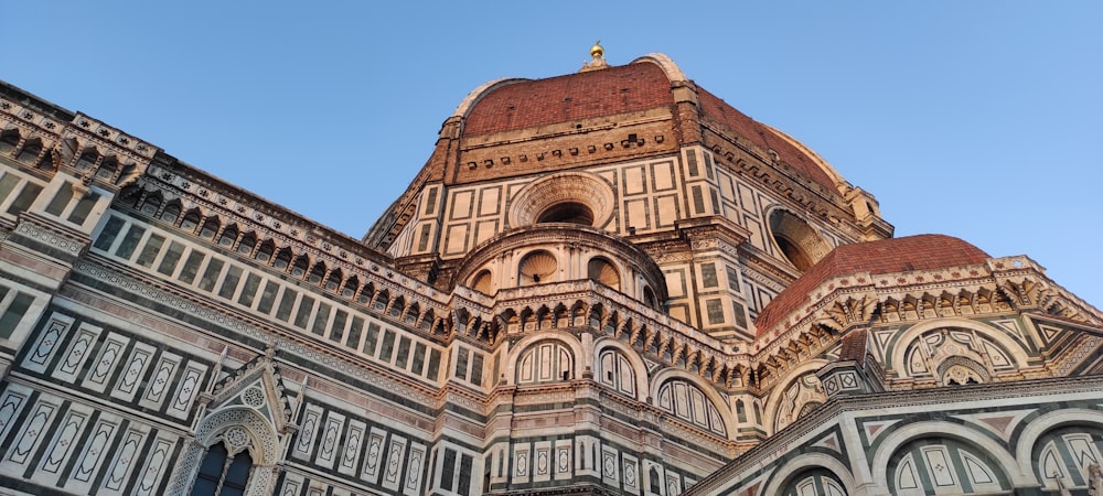 a very tall building with a clock on it's side