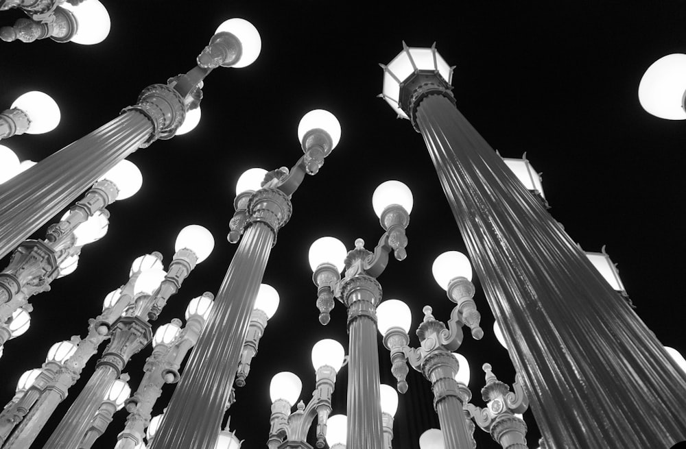 a black and white photo of street lights