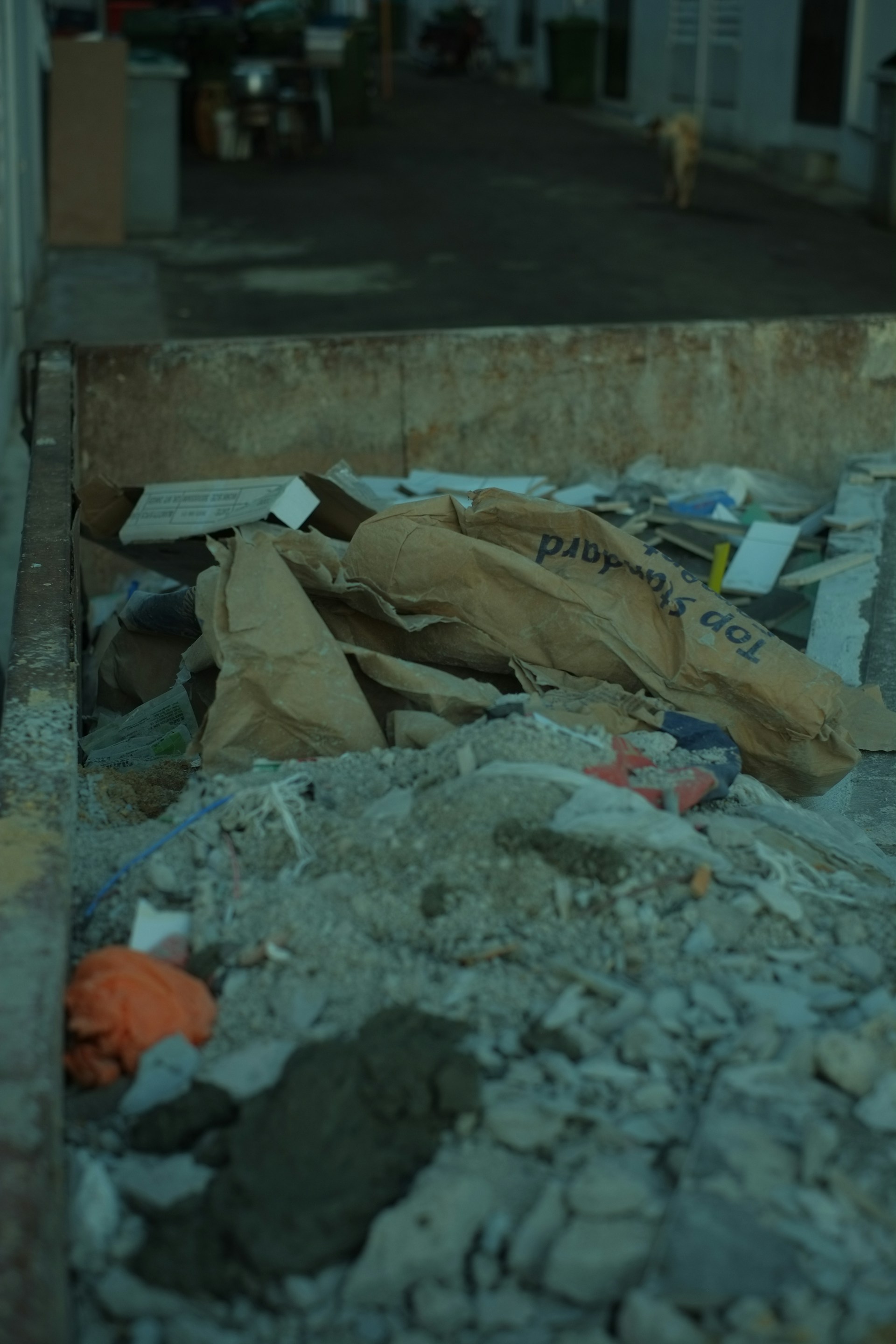 a pile of garbage sitting on the side of a road