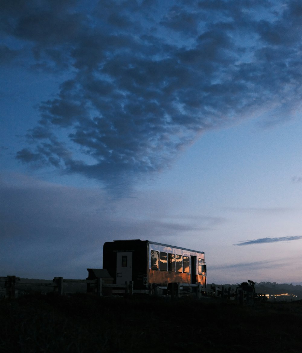 a truck is parked on the side of a hill