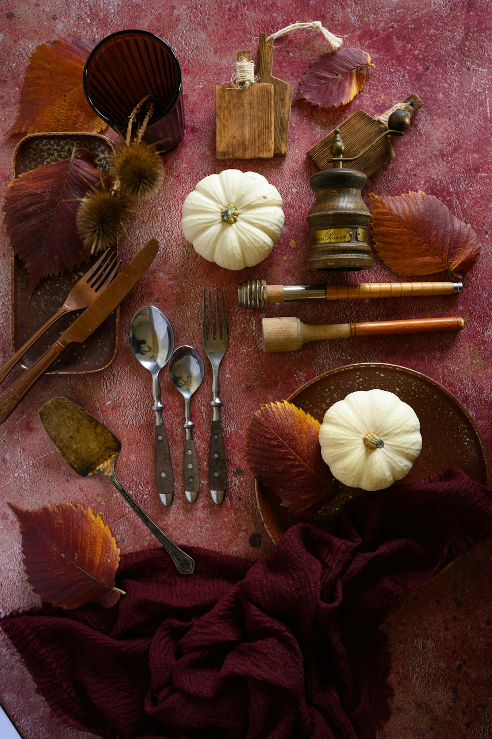 a table topped with lots of different types of utensils