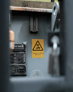 a metal box with a warning sign on it