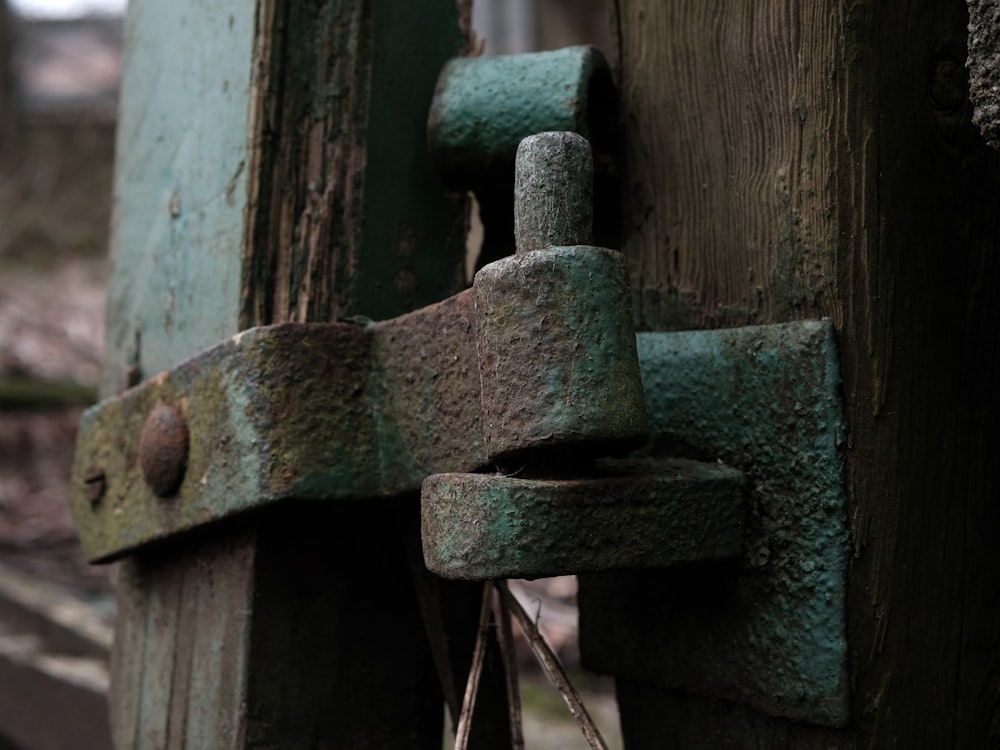 a close up of a door handle on a wooden door