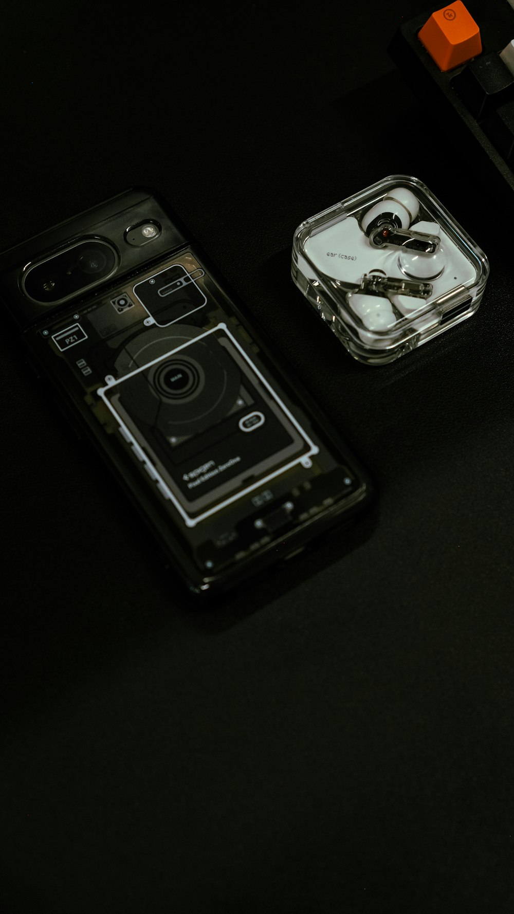 a couple of cell phones sitting on top of a table