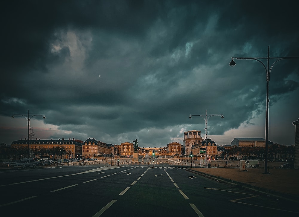 a city street with a cloudy sky in the background