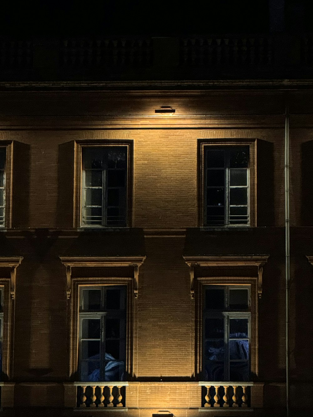 a building with windows lit up at night