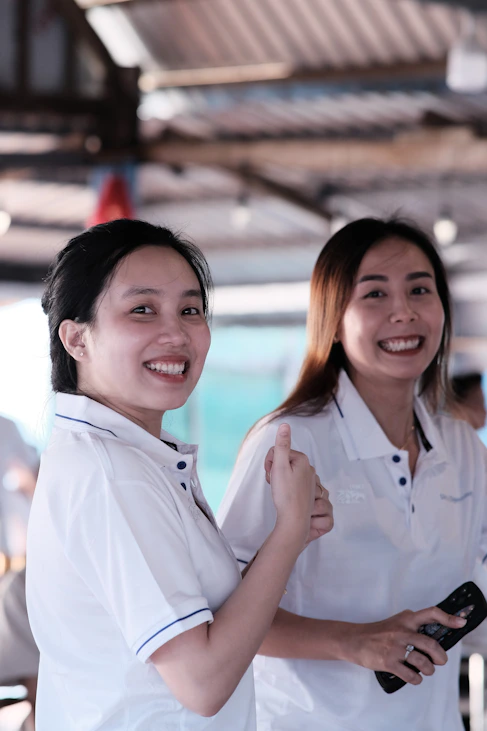 a couple of women standing next to each other