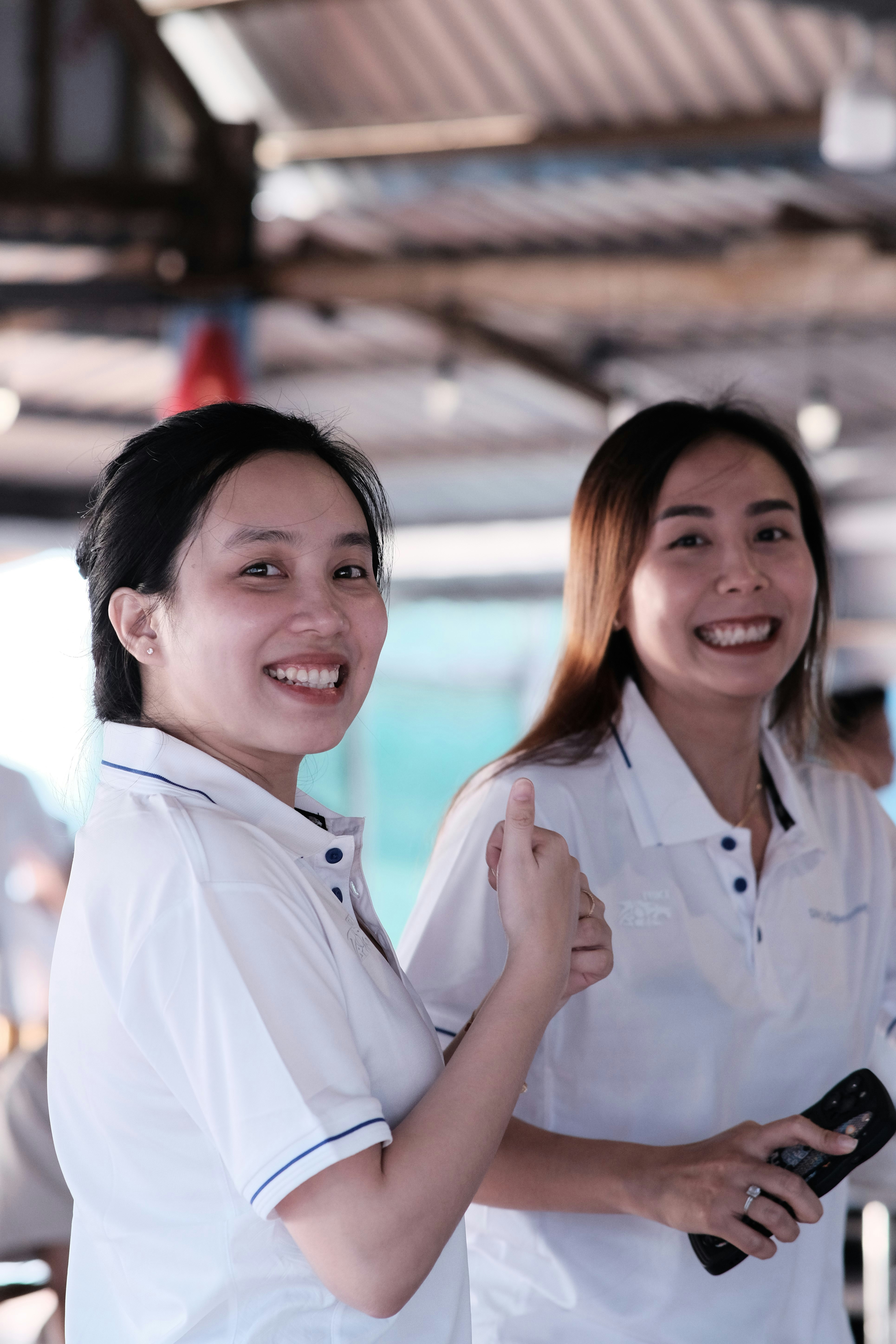 a couple of women standing next to each other