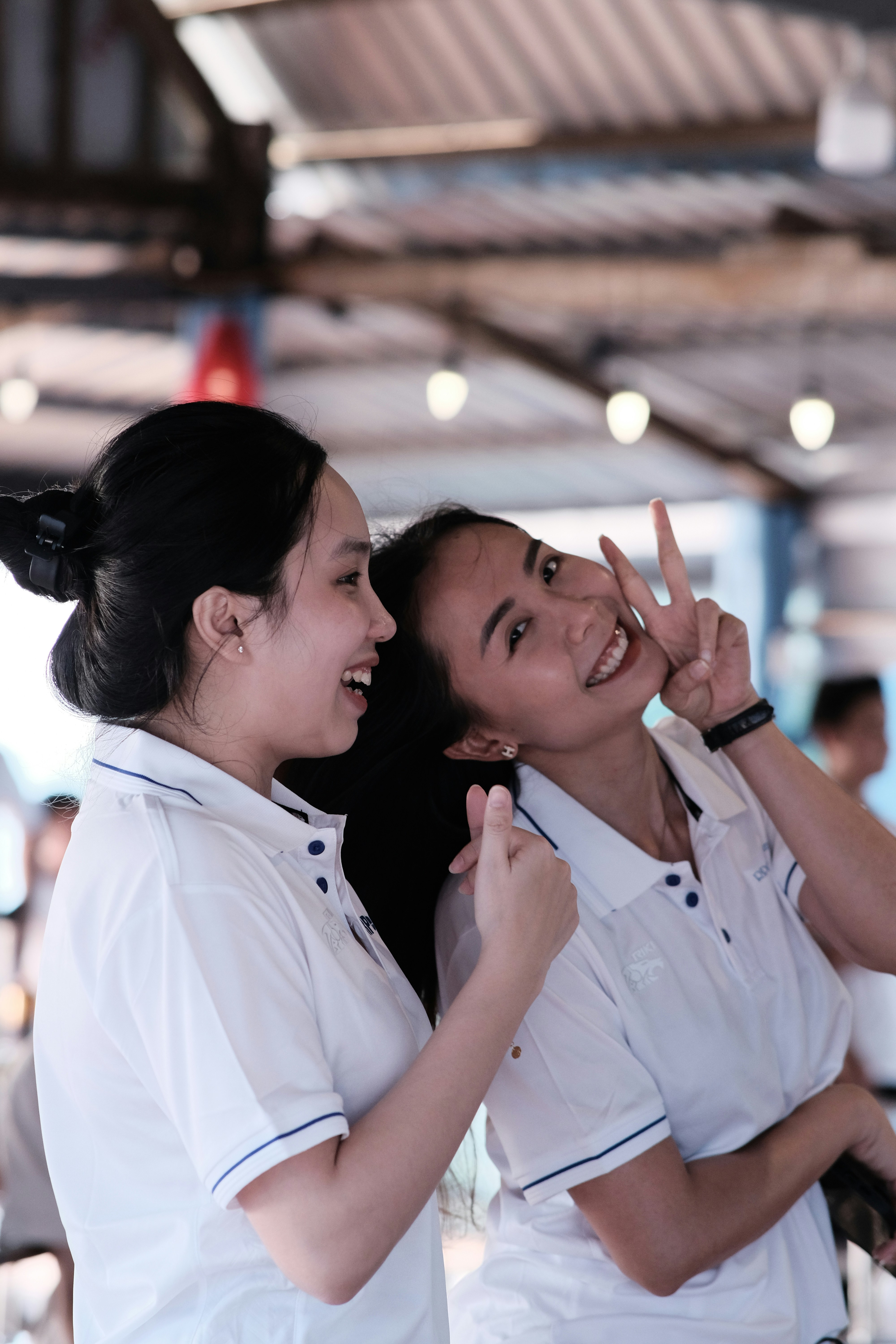 two women in white uniforms standing next to each other