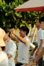 a group of people standing around each other