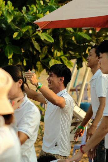 a group of people standing around each other