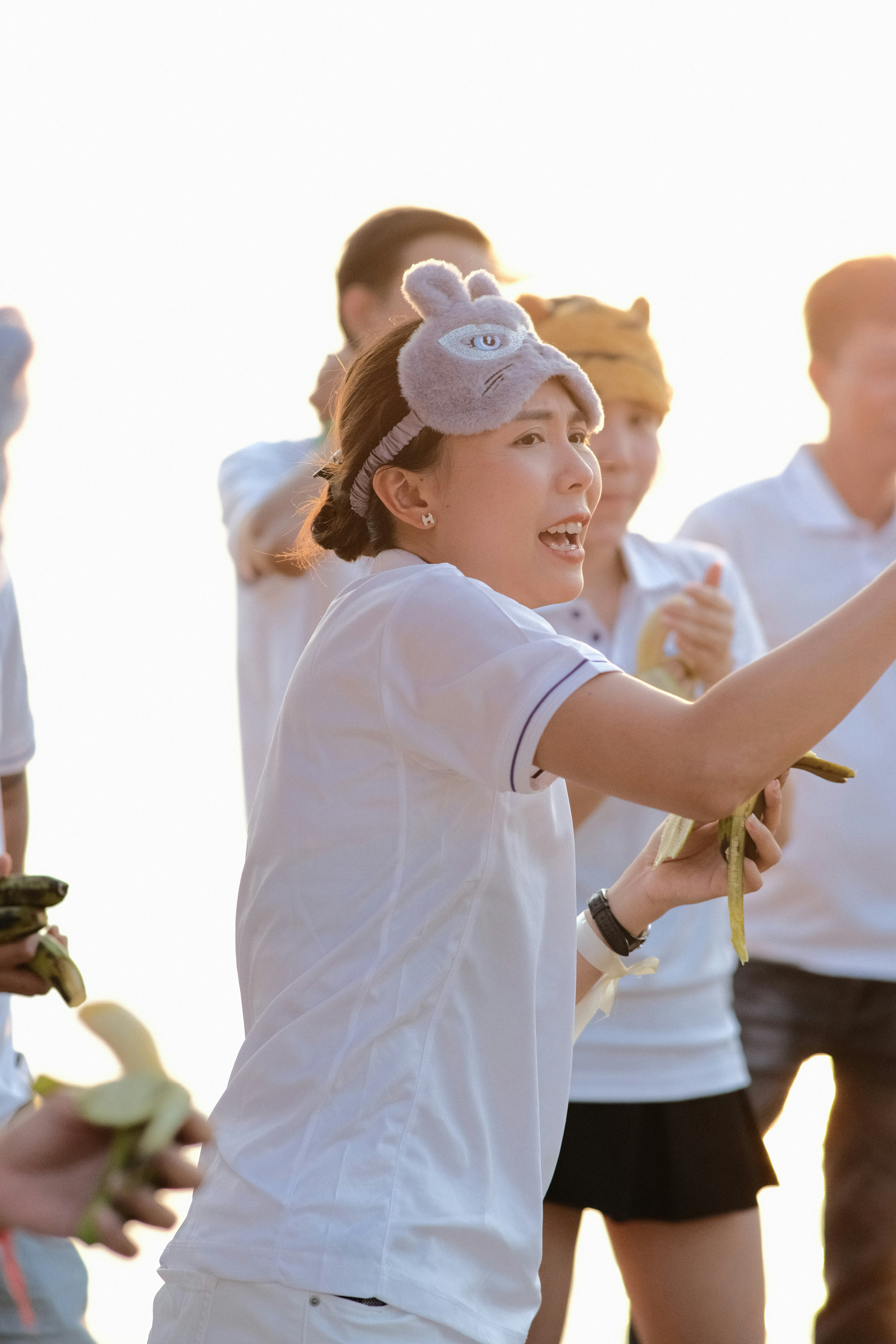 a woman holding a tennis racquet on top of a tennis court