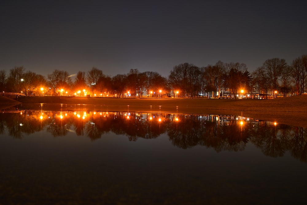 a body of water with a bunch of lights on it