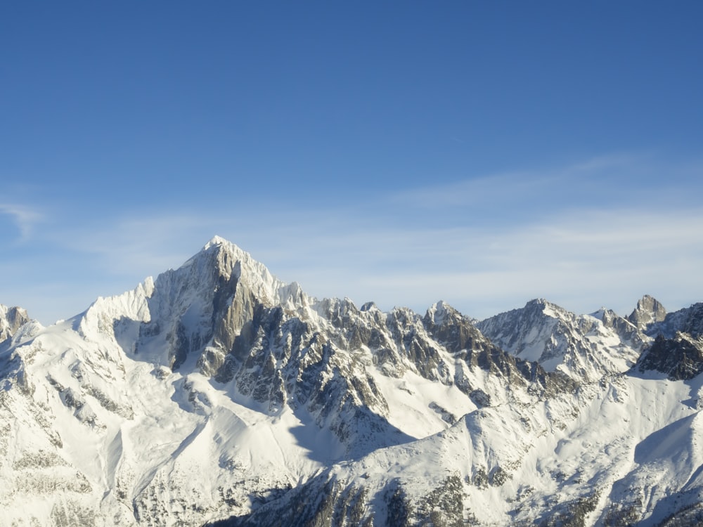 a view of a snowy mountain range from a plane