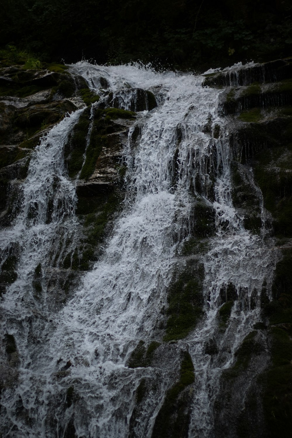 a waterfall with lots of water running down it