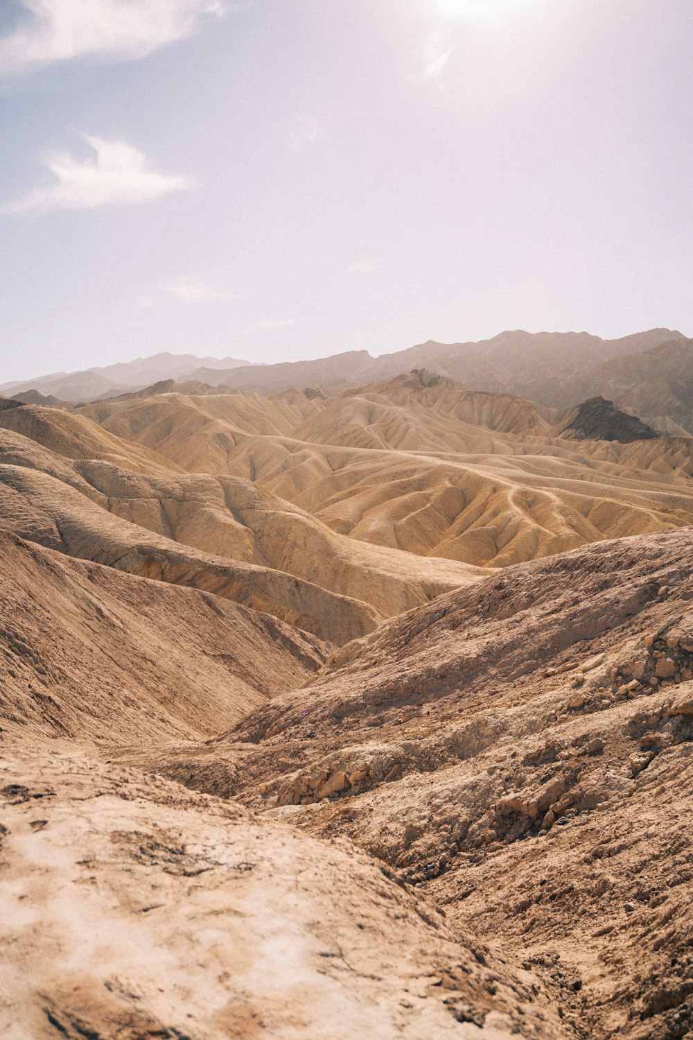 a man riding a horse on top of a dirt hill