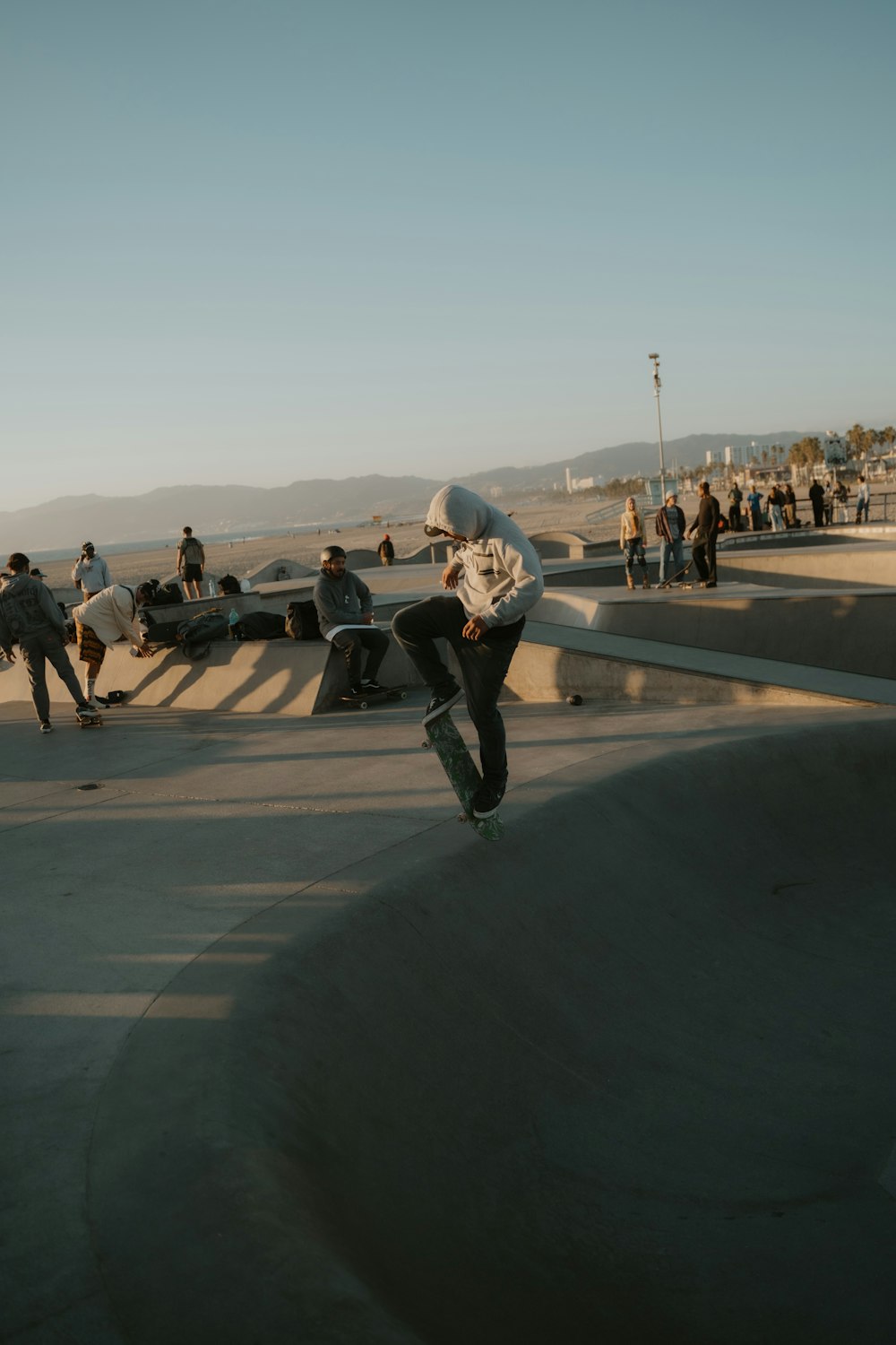 a man riding a skateboard up the side of a ramp