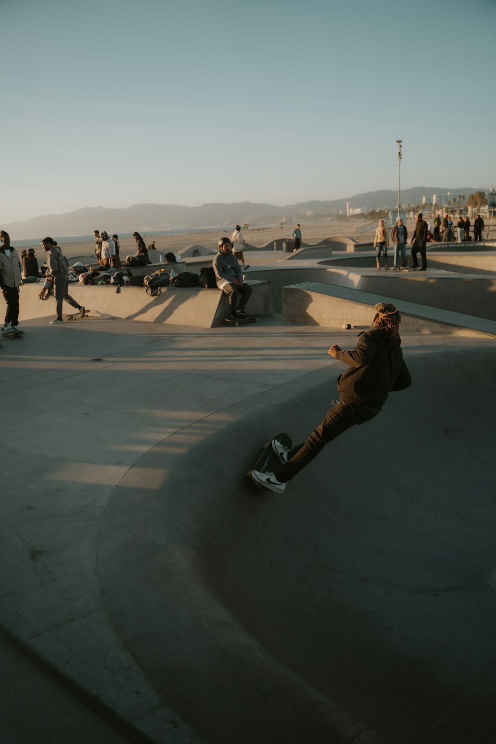 a man riding a skateboard up the side of a ramp