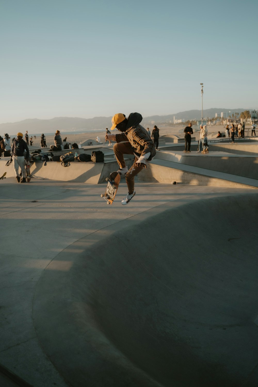 a man flying through the air while riding a skateboard