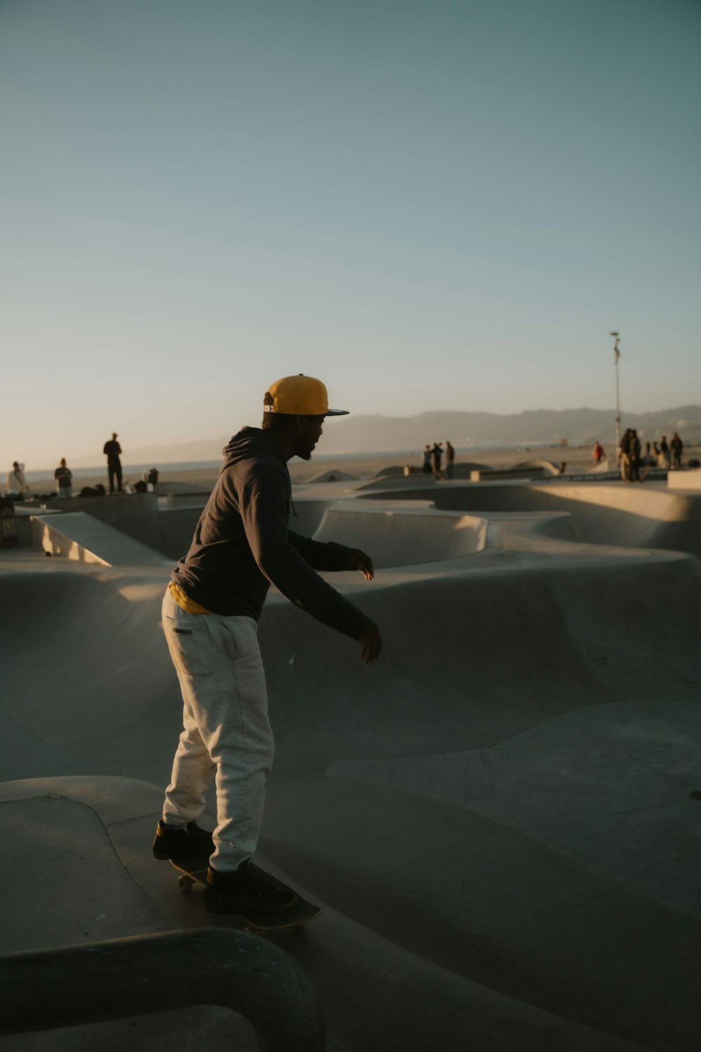 a man riding a skateboard on top of a ramp