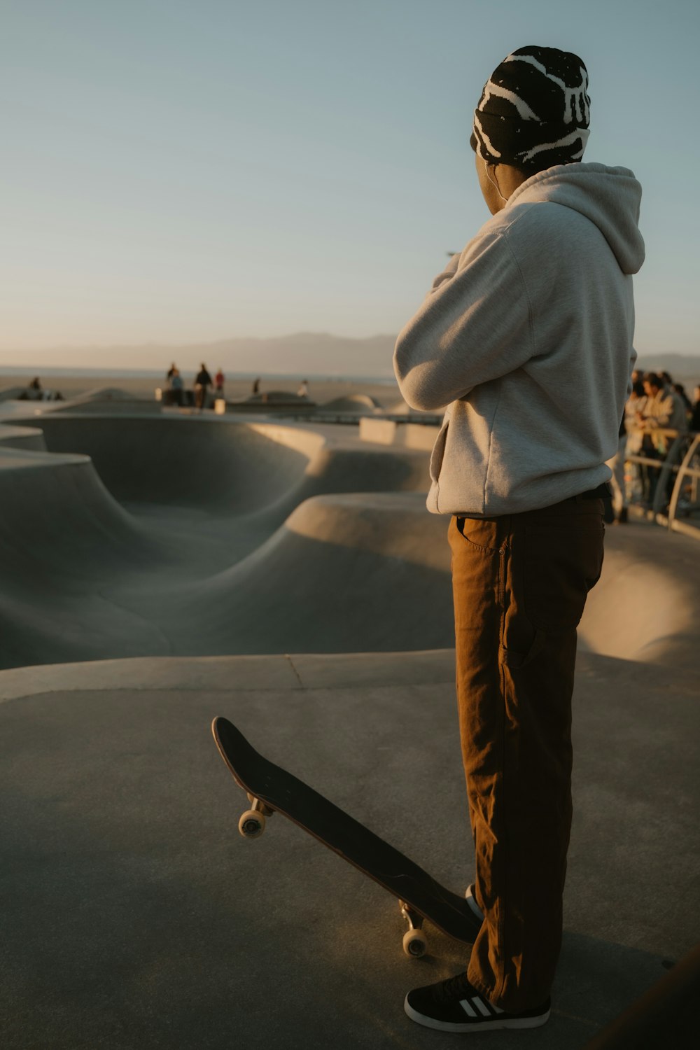 a person standing on a skateboard at a skate park