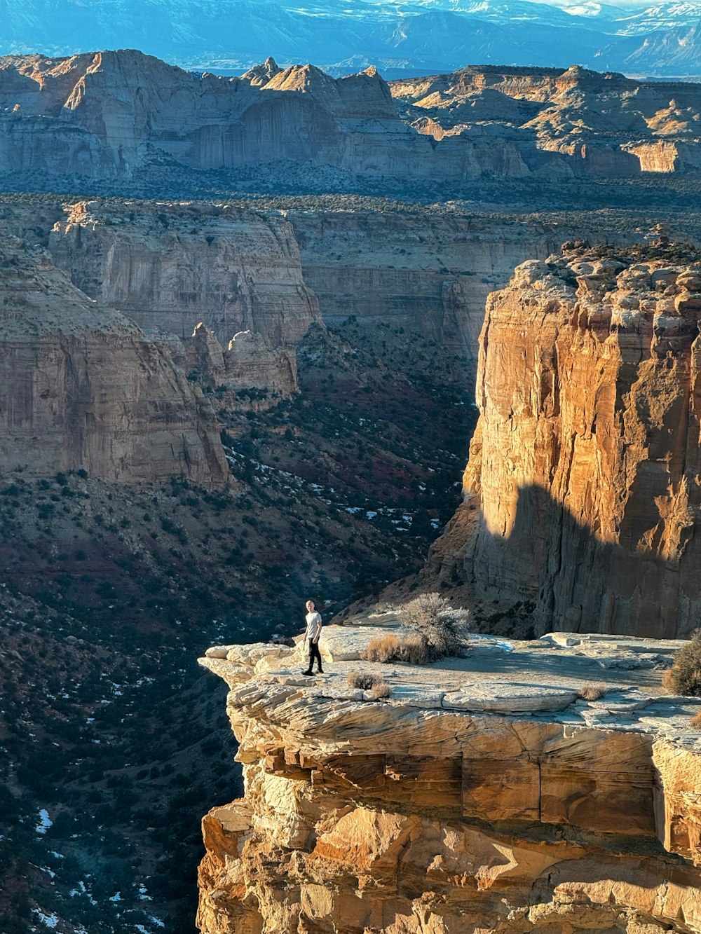 a person standing on top of a cliff