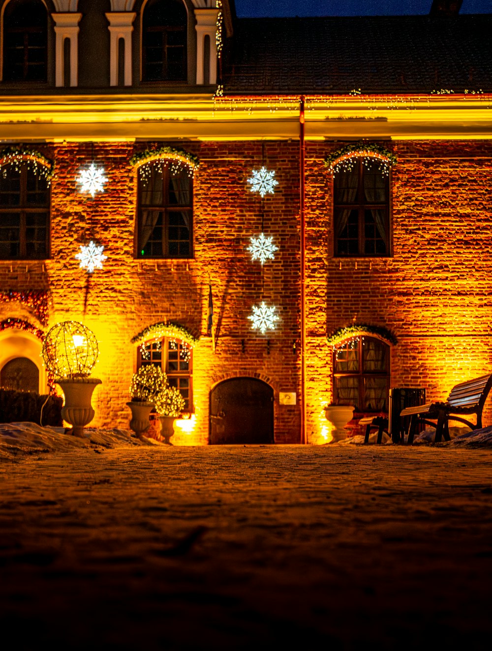 a large brick building with snowflakes on it