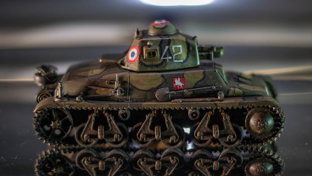 a toy tank with numbers on it sitting on a table