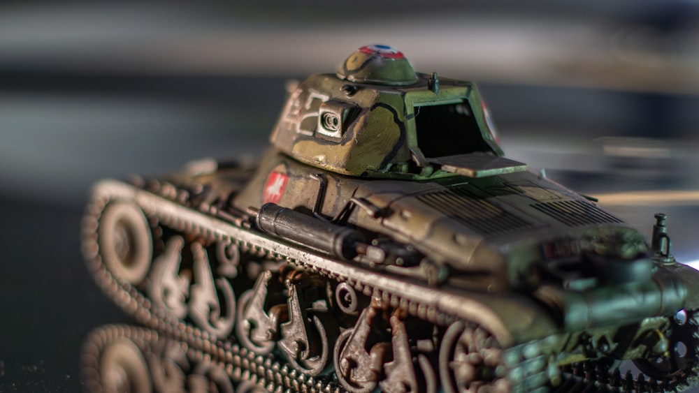 a close up of a toy tank on a table