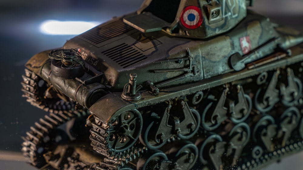 a close up of a toy tank on a table