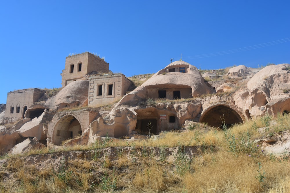 a group of buildings built into the side of a hill