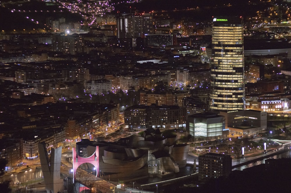 a view of a city at night from the top of a building