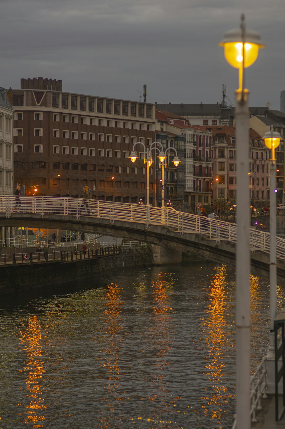 a bridge over a body of water at night