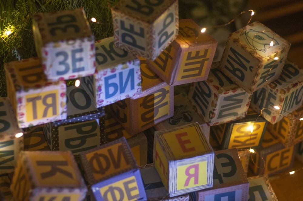a christmas tree decorated with blocks and lights