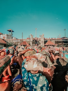 a crowd of people standing around each other