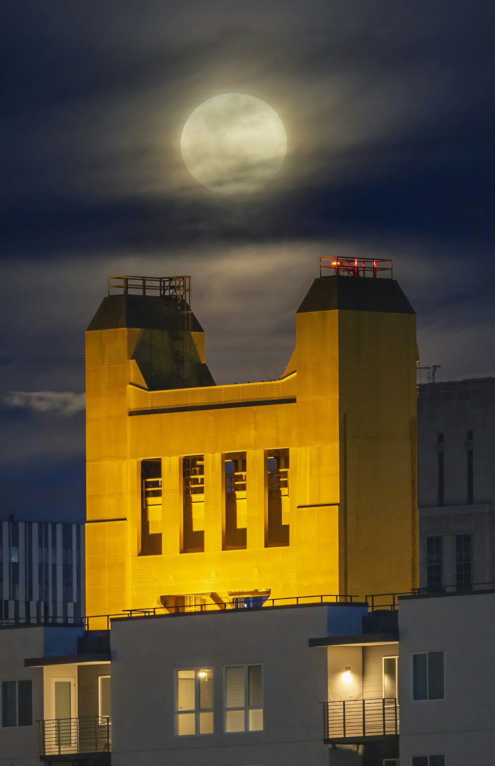 a building with a full moon in the background