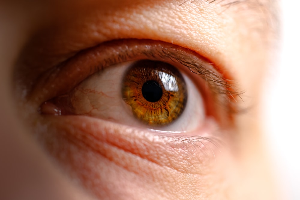 a close up of a person's brown eye