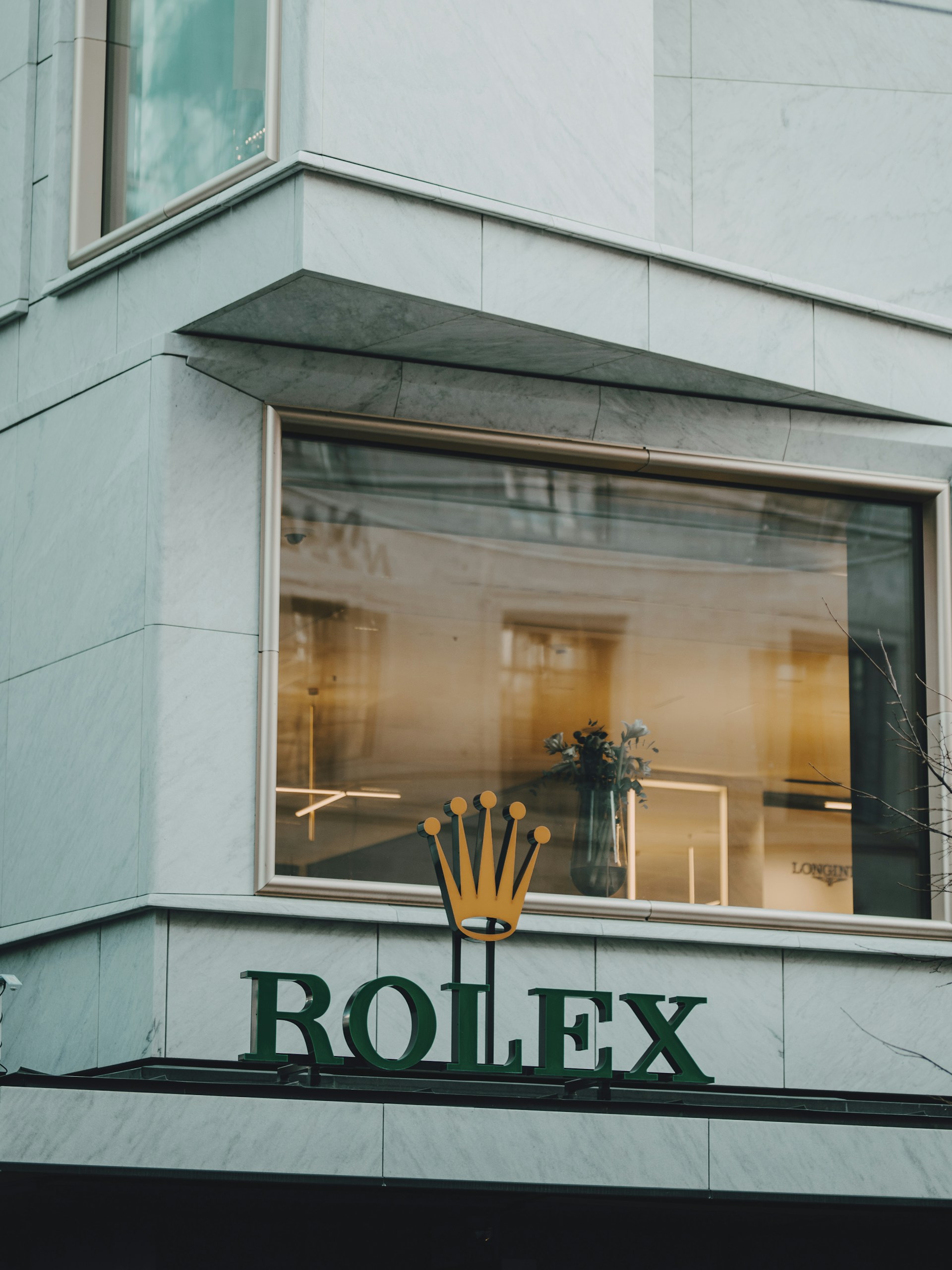 a building with a sign that says rolex on it