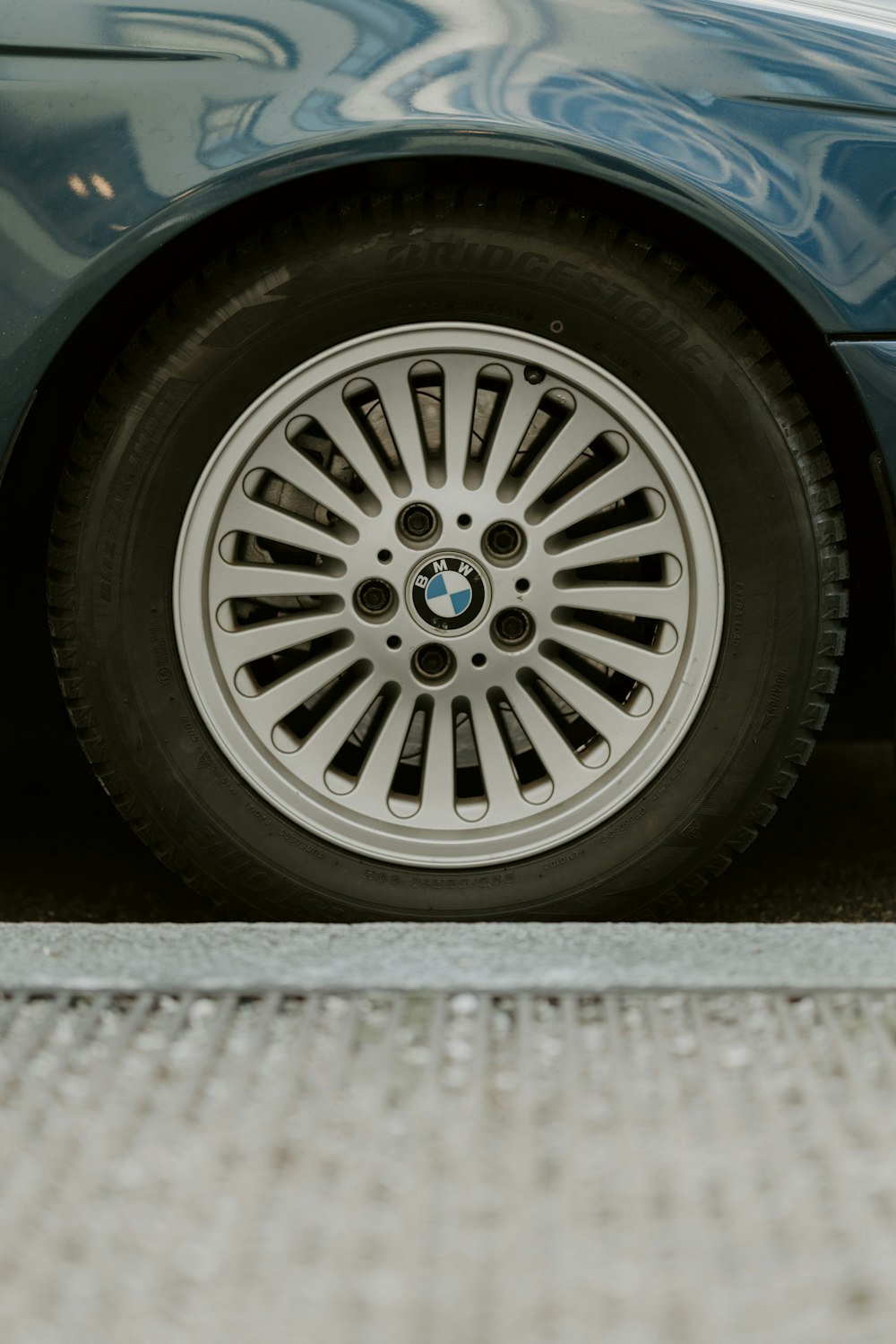 a close up of a car tire on the ground