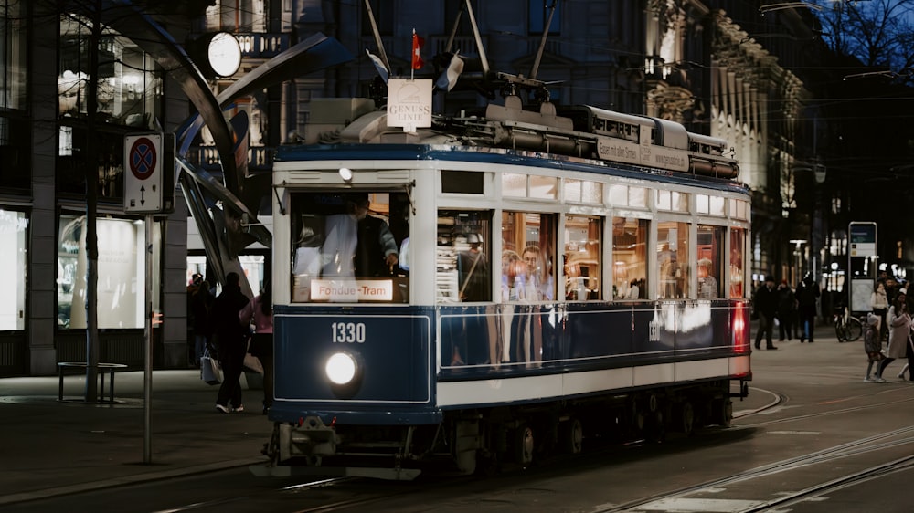 a trolley car on a city street at night