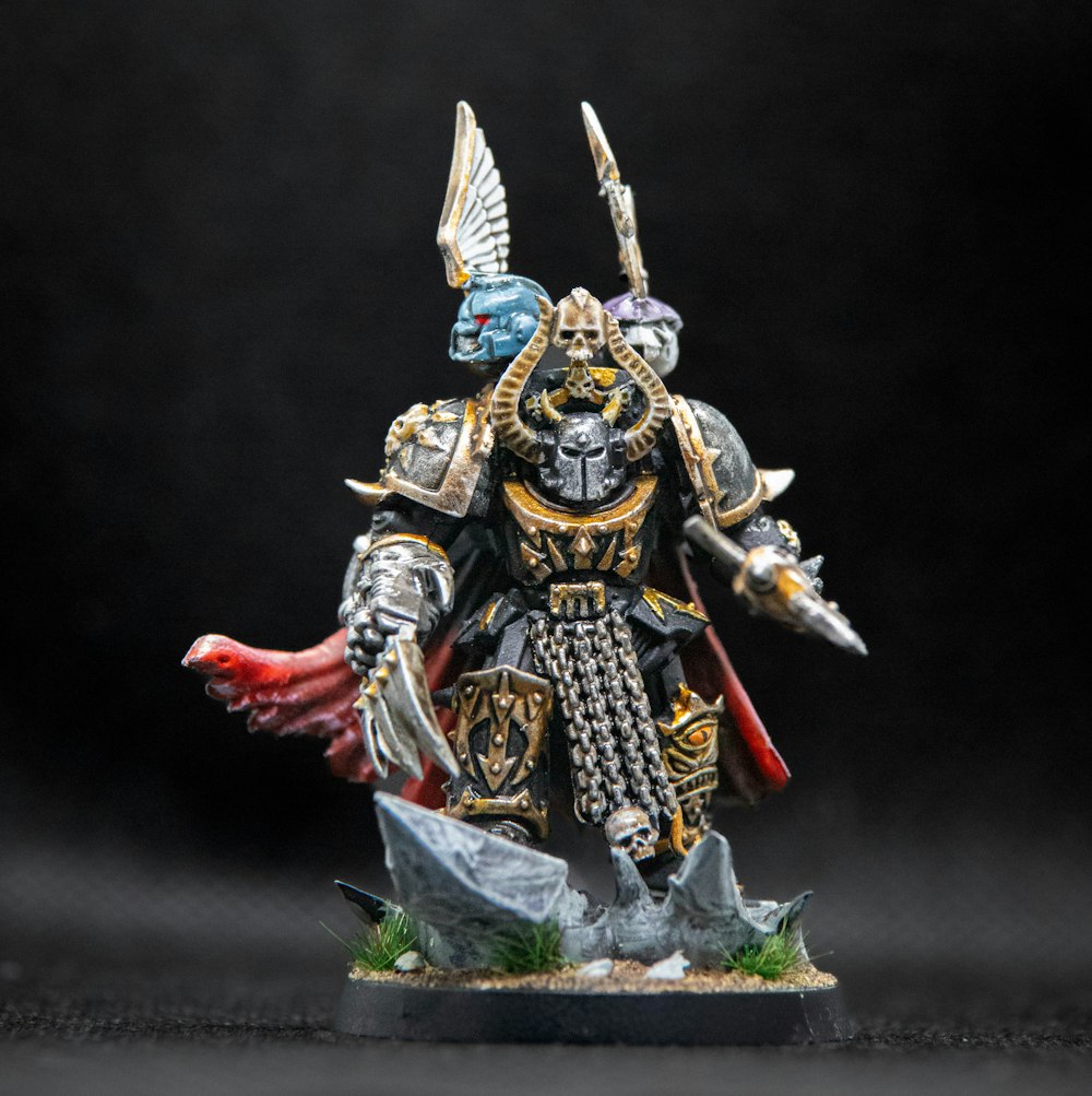 a painted warhammer with a sword and armor